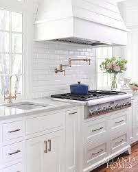 A White Shiplap French Hood Is Mounted To Mini Beveled Subway Backsplash Tiles Above A Stainless Steel Co Shiplap Kitchen Kitchen Remodel Small Kitchen Remodel