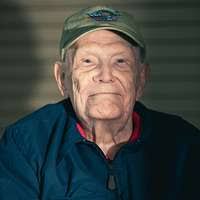 Air Force Master Sgt. (Ret.) Dyana St. John looks around