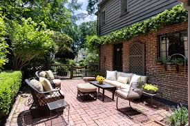 Here, a black pergola with green canopy covers the brick and concrete patio elegantly. Red Brick Patio Ideas Diy Paver Designs Pictues