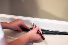 Use blue painter's tape to tape off the carpet right next to the trim. The Beginner S Guide To Patching And Painting Baseboards Abby Lawson