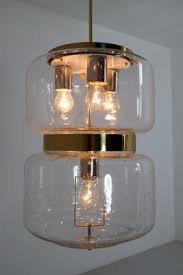 Each hand blown glass piece is also hand signed by the artist and comes with a certificate of authenticity from the studio. Mid Century Austrian Brass And Hand Blown Glass Pendant Lamp 1960s For Sale At Pamono