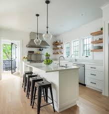 See more ideas about floating shelves, wood floating shelves, floating shelves diy. White Kitchen Cabinets With Caramel Stained Wood Floating Shelves Cottage Kitchen