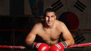 Huni, the australian heavyweight champion and a queenslander, was picked up by the fox sports cameras, signalling a thumbs down before the camera panned out to reveal he was right behind gallen. Justis Huni Is Justin Huni From The Bethania Boxing Club The Man To Break Australia S Olympic Games Boxing Drought The Courier Mail