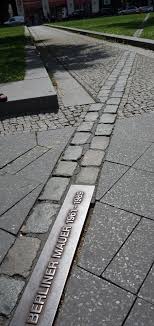 The Berlin Wall Is Mostly Gone But Ghost Markers On The Ground Mark Old Routes Berlin Wall Berlin Germany Berlin