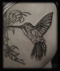 A hummingbird tattoo would be no different. Black And Grey Hummingbird Tattoo Design Hummingbird Flower Tattoos White Bird Tattoos Hummingbird Tattoo