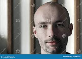 Young man with a bald head stock photo. Image of eyes