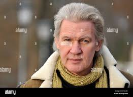 Irish singer and composer Johnny Logan look into the camera at Kleinheesloh  Lake in Munich, Germany, 19 December 2012. Photo: Frank Leonhardt Stock  Photo