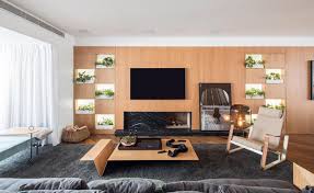 Measure the space around your fireplace and on either side. Living Room Shelving Designed For Plants Instead Of Books