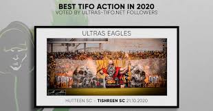 A bald eagle flies majestically over the rising sun, with the engravings united states of america and twenty dollars above the eagle. Tishreen S Sc Voted Best Tifo In 2020