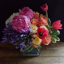 Aurora Designed With Agapanthus Tulips Peonies And Roses This Vibrant And Colorf Purple Flower Arrangements Jardin Floral Design Beautiful Flowers Images