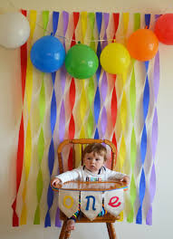 high chair with crepe paper and balloon for first birthday party photo background success candyland birthday birthday photos birthday decorations