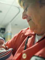 Volunteers provide comfort to infants in hospital