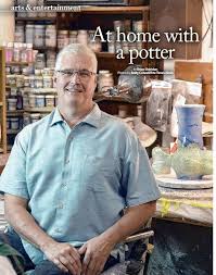 Tom Hubert at home with his art