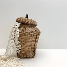 Choose trunks that double up statement tables, store bedding in woven baskets, or enhance your desk with decorative storage boxes. Vintage Handcrafted Lidded Basket Woven Rattan Urn With Lid Tall Wicker Vase Snake Charmer Basket Handcraft Basket Vintage Pottery