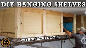 After installing the first one at 48 deep, i realized that was deeper than i wanted, so i made the second. Diy Hanging Storage Shelves With Sliding Doors Overhead Garage Storage Youtube