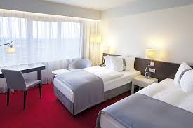 Business guests enjoy the breakfast. Holiday Inn Berlin Airport Conference Centre Schoenefeld Area Information