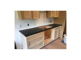 Position the first cabinet set the first cabinet 1/4 in. Contractor Installed Cabinets Before Painting