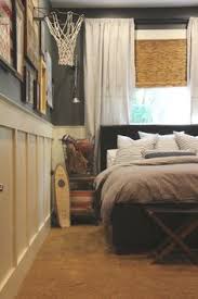 A batman wall sticker adds a bit of fun to this otherwise plain room. Teen Boy Bedrooms