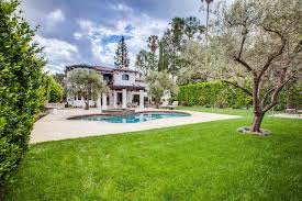 Spanish Colonial Home Features Landscaped Backyard With Swimming Pool Mediterranean Landscaping Spanish Colonial Homes Spanish Colonial