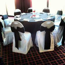 black sash and white chair covers overlooking orange county orangecounty oc black sash bow wedding tablecl chair covers white chair covers table cloth