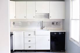 The rails make hanging ikea cabinets a cinch! How To Design And Install Ikea Sektion Kitchen Cabinets Abby Lawson