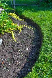 Do you need edging for flower beds? How To Edge Flowerbeds Like A Pro Via Funky Junk Interiors Landscape Edging Garden Edging Flower Bed Edging