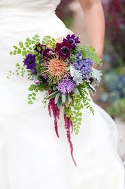 Owner katie has more than 20 years of experience in the floral industry and delights in highlighting the beauty of colorado in her arrangements. Be Inspired By Bridal Bouquets Brimming With Delicate Ferns Bold And Colourful Woodland Wedding Bouquet Woodland Wedding Bridal Party Flowers