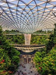 The world's tallest indoor waterfall has started flowing at the new jewel changi airport complex in singapore. Rain Vortex Waterfall And Canopy Bridge At Jewel Changi Airport Complex Photo By Tuáº¥n Nguyá»…n Via National Geograp Changi Waterfall Singapore Changi Airport