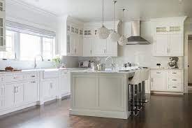 Otte removed two walls and pushed another back to add 169 square feet to the room, fit in a large island and open the kitchen to the living room. Light Gray Kitchen Island With White Leather Bar Stools Transitional Kitchen