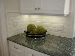 The Side Backsplash Dilemma Should You Have One Or No Designed Green Granite Countertops White Beveled Subway Tile Subway Tile Backsplash Kitchen