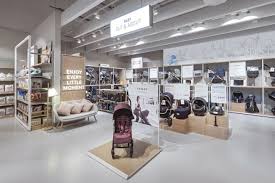 In A Layout Zoned Into Worlds Based On New Parents Key Shopping Missions The Popular Categories Of Baby Fashio Baby Store Display Baby Showrooms Baby Store