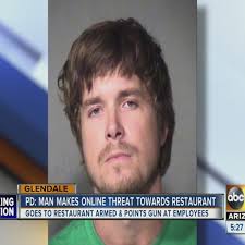 Man points gun at workers after online threat