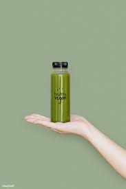 Download Premium Psd Of Woman Holding A Bottle Of Celery Juice Mockup Bottle Design Packaging Juice Packaging Celery Juice