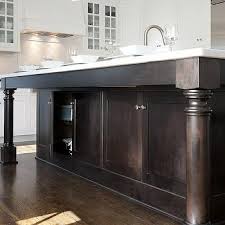 Add a thick wood table top or solid wood countertop to complement your solid wood kitchen island legs and posts. Turned Wood Cabinet Supports Design Ideas