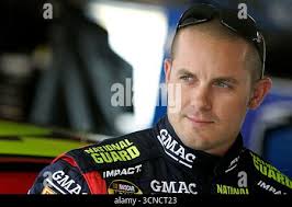 NASCAR Craftsman Truck Series drivers Clay Rogers (75), Joey Clanton (09),  and Willie Allen (13) slide across the front stretch grass after driver  Brian Scott (16) hit the wall exiting turn four