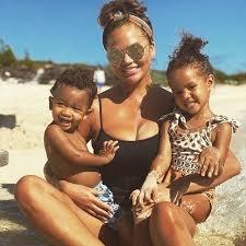 The cravings author, 34, frolicked at the beach with her husband, 41, and their two kids — luna, 4, and miles, 2 — in the video before standing at the shore with legend. Chrissy Teigen Says It Was Tough To Connect With Her Kids