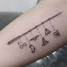 Freaking Awesome But I Would Like To Symbols From Diff Books Like Ouroboros From Discovery Of Witches Harry Potter Tattoo Small Harry Potter Tattoos Tattoos