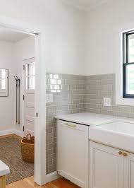 If you lay the tiles up to the cabinets and in future want to replace the cabinets, all you have to do is cut along the grout lines of the partial tiles and smash them out. How To Tile A Kitchen Backsplash A Video Grey Glass Tiles Backsplash Kitchen Backsplash