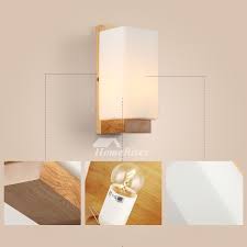 Potterybarn.com has been visited by 100k+ users in the past month Scandinavian Style Wall Sconce Fashion White Modern Solid Wood Bedside Wall Light Creative Candle