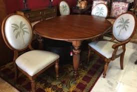Tommy Bahama French Indies Style Dining Set With A Banana Palm Tree Woven Into The Back Cushion Of Each C Palm Trees Furniture Furniture Wicker Patio Furniture