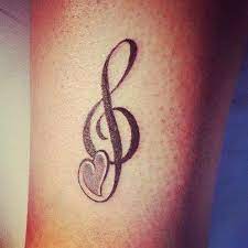 This one here, as an example, shows a perfect treble clef inked within a lotus flower design. 32 Cool Music Note Tattoo Ideas Music Notes Tattoo Music Tattoo Designs Music Tattoos