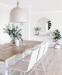 This white dining room showcases pristine walls and ceiling contrasted by chevron wood flooring. White Dining Room 25 Mesmerizing Ideas With Gorgeous Decor