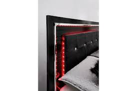 Dressed in a dark cherry finish, this elegant bed is complimented by a two toned, faux leather. Kaydell Ashley Furniture Homestore