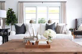 Dark wood such as the a cottage style living room can instantly illicit coastal charm with simple decorative details like hanging starfish a nautical inspired lampshade and rope pillow tassels. California Coastal Inspired Farmhouse With Delicious Design Details Casual Home Decor Coastal Interiors Design Coastal Style