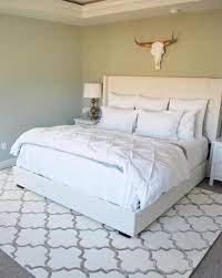 geometric pattern area rug under a full size bed bedroom rug placement bedroom rug size bedroom area rug