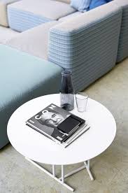 • this handmade, glass mosaic tile accented circular coffee table is a great way to break up the squares and rectangles in your home decor. Round Small Table With Painted Steel Base For Outdoors Idfdesign