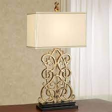 Comparison shop for floor lamp antique gold home in home. Delyth Scroll Antique Gold Table Lamp