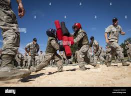 U.S. AIR FORCE ACADEMY, Colo. -- Maj Daniel Speir uses a Shot Indicating  Resetting Trigger (SIRT) Training Pistol during the completion of his Air  Force Combatives Program (AFCP) Master Instructor Certification at