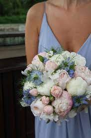 Hanging flowers, crystal chandeliers, and lush floral details with a palette of bright pink, white, and powder lush floral details and luxurious white textures add dimension to a modern palette of bright pink and dusty blue. Flower Design Events Epic Posting Alert The Beautiful English Summer Wedding Day Of Nicole T Blue Wedding Flowers Pastel Wedding Blue And Blush Wedding