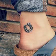 Tales indicate all the luck is held within the curve of the shoe. Horseshoe Tattoo Tattoo Designs For Women